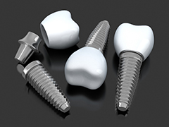three dental implants lying on a flat surface 