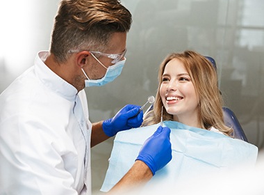 young woman talking to her dentist 