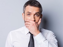 man covering mouth