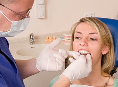 doctor placing invisalign