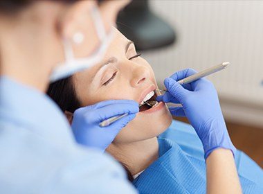 woman sedated getting cleaning