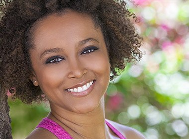 woman smiling outside