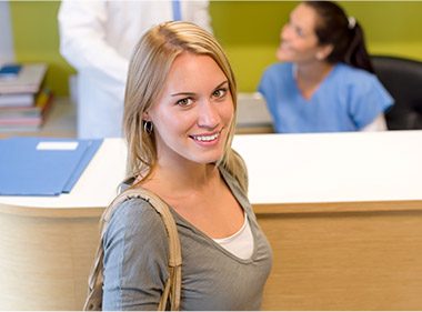 woman smiling up at camera