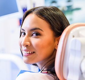 woman smiling over shoulder