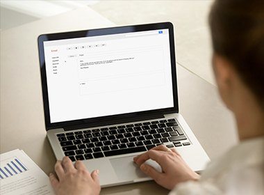 man writing email