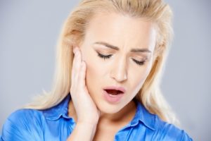 Woman with jaw pain