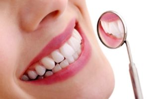 Healthy smile and dental mirror