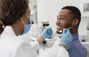 young man talking to his dentist in Lehigh Valley