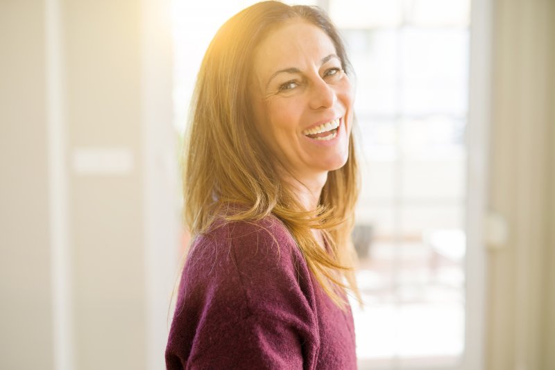 middle aged woman laughing and smiling