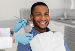 Man smiling at his dental cleaning